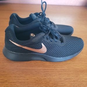 Black and rose gold Nike sneakers